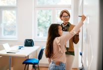 mature teacher assisting schoolgirl in writing ass 2022 12 06 01 16 45 utc 1024x683