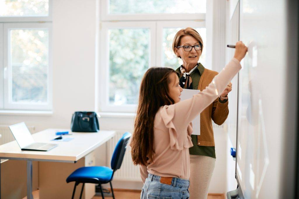 Yabancı Öğretmenlere Türkçe Şartı! 1 mature teacher assisting schoolgirl in writing ass 2022 12 06 01 16 45 utc