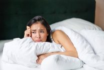 sad and gloomy asian girl lying in her bed grimac 2023 11 27 05 07 12 utc 1024x683