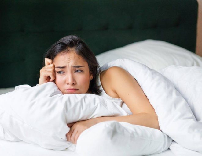 sad and gloomy asian girl lying in her bed grimac 2023 11 27 05 07 12 utc 1024x683