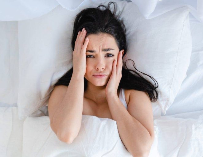 sad young caucasian woman lying in the bed with wh 2023 11 27 04 59 23 utc 1024x683